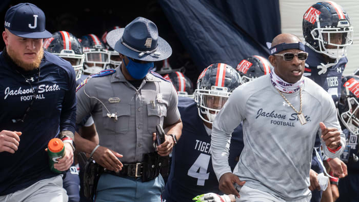 Deion Sanders runs out of the tunnel
